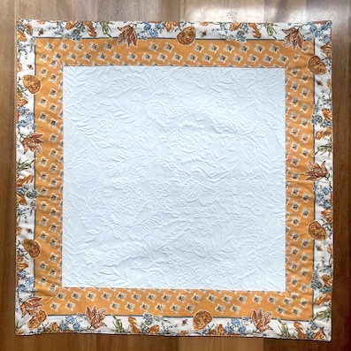 quilted table centre with yellow border